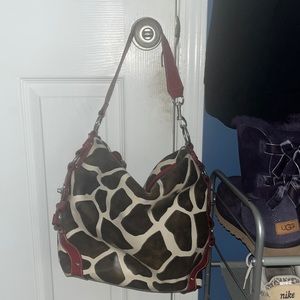 Giraffe print leather purse